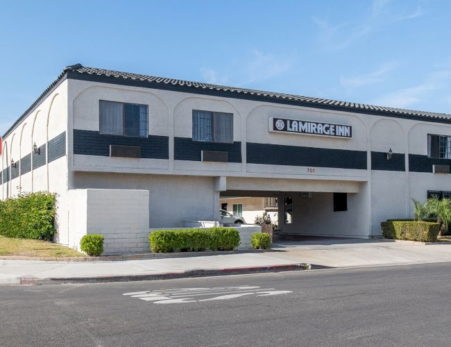 The image shows a two-story building with the signage 